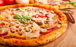 two pizzas on a table
